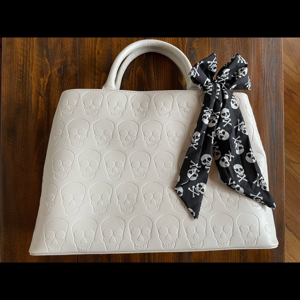 Betsey Johnson creamy white skull purse. Never used. No shoulder strap.